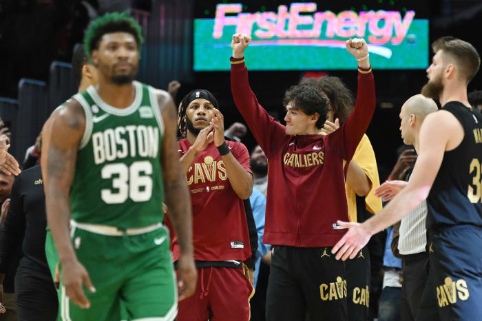 Nov 2, 2022; Cleveland, Ohio, USA; Cleveland Cavaliers forward Cedi Osman (16) celebrates as Boston Celtics guard Marcus Smart (36) walks off the court after the Cavaliers beat the Celtics at Rocket Mortgage FieldHouse. Mandatory Credit: Ken Blaze-USA TODAY Sports